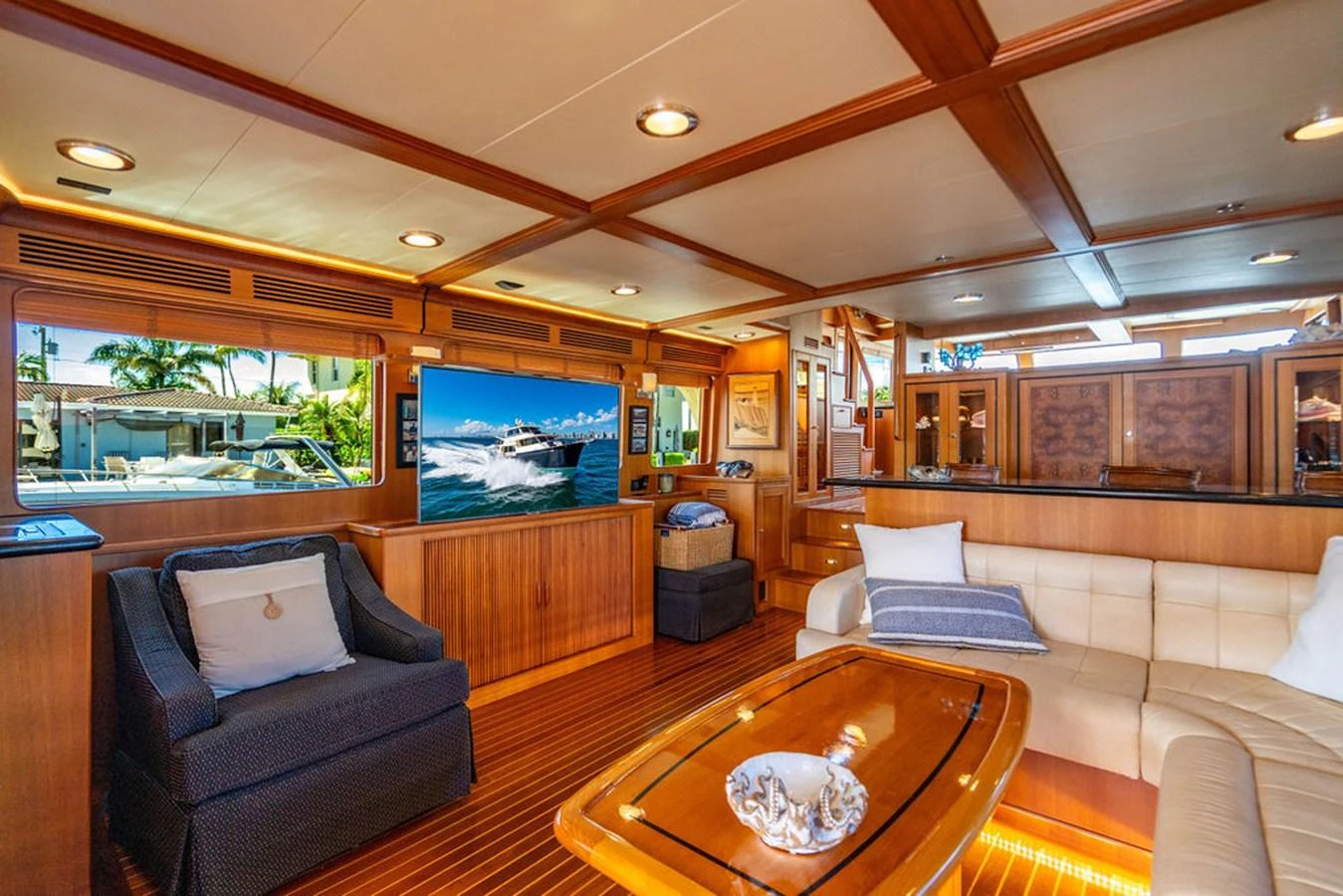 a living room with a large screen aboard NEVER BETTER Yacht for Sale