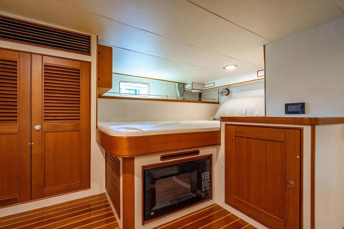 a kitchen with wooden cabinets aboard NEVER BETTER Yacht for Sale