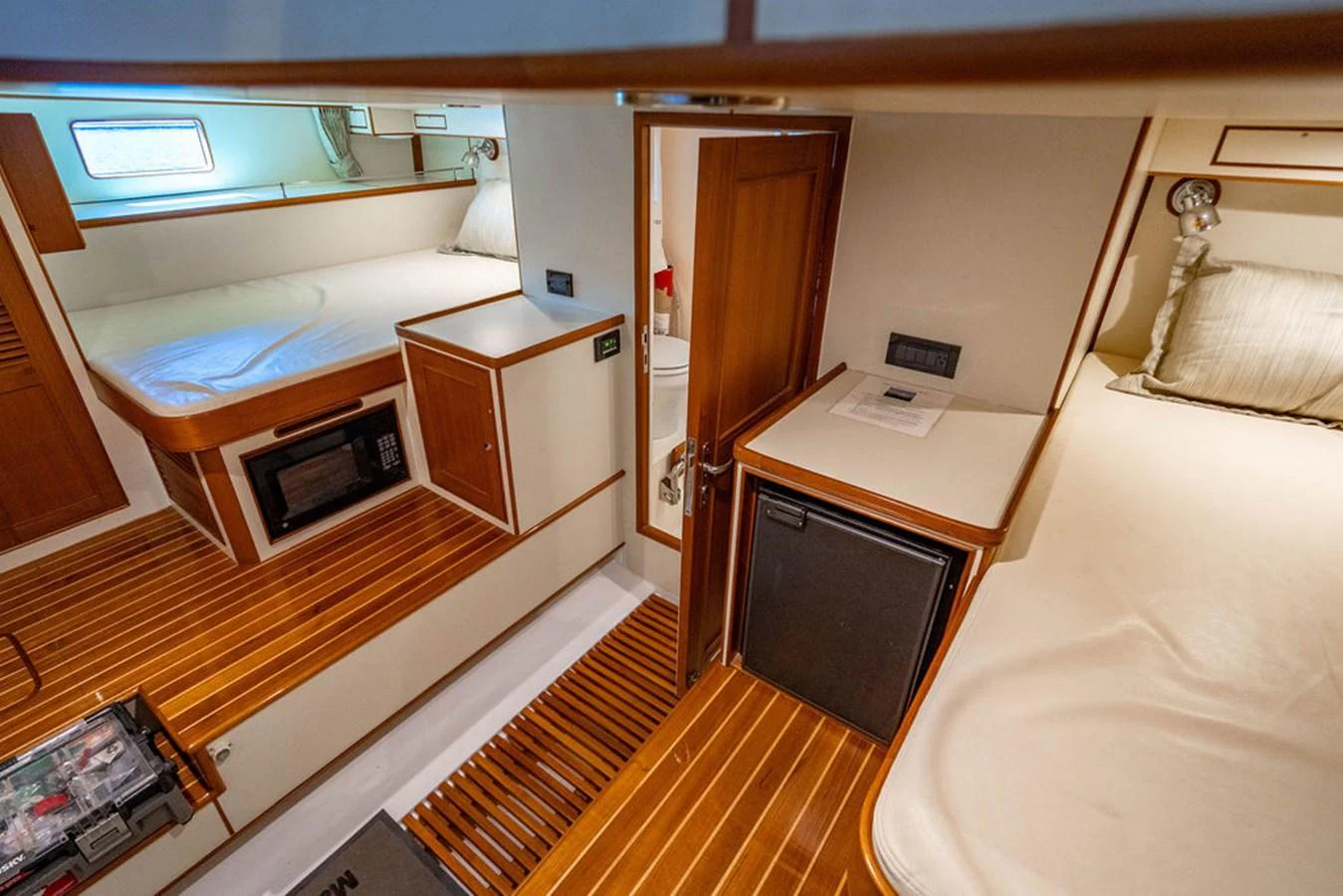 a room with a bed and a desk aboard NEVER BETTER Yacht for Sale