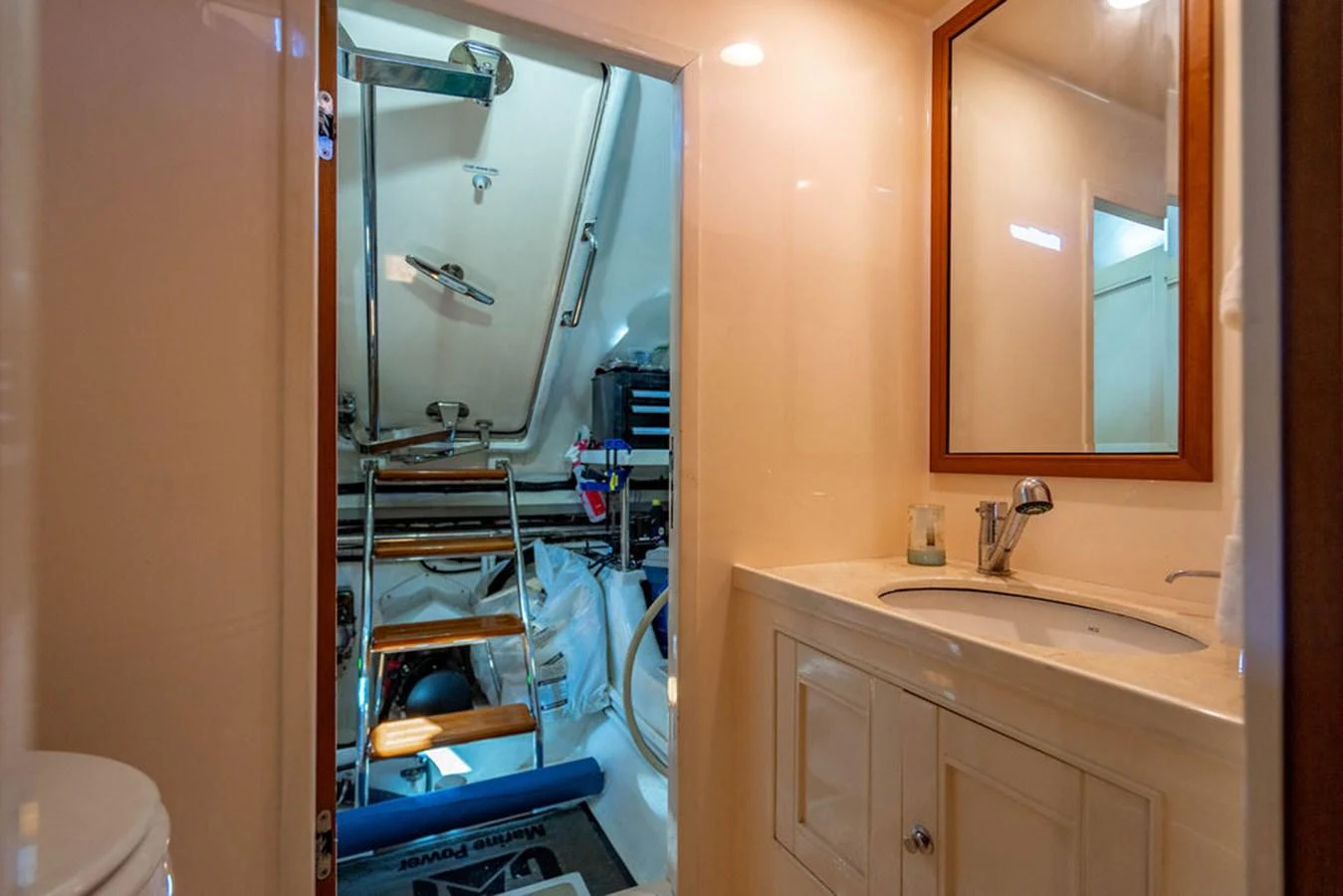 a bathroom with a sink and a mirror aboard NEVER BETTER Yacht for Sale