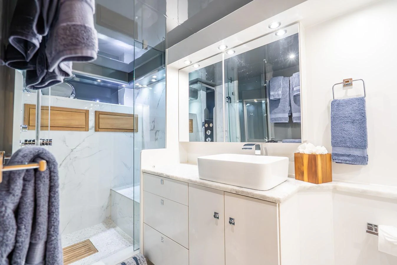 a bathroom with a sink and a mirror aboard AZURE Yacht for Sale