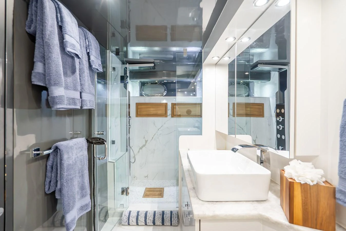 a bathroom with a sink and a mirror aboard AZURE Yacht for Sale