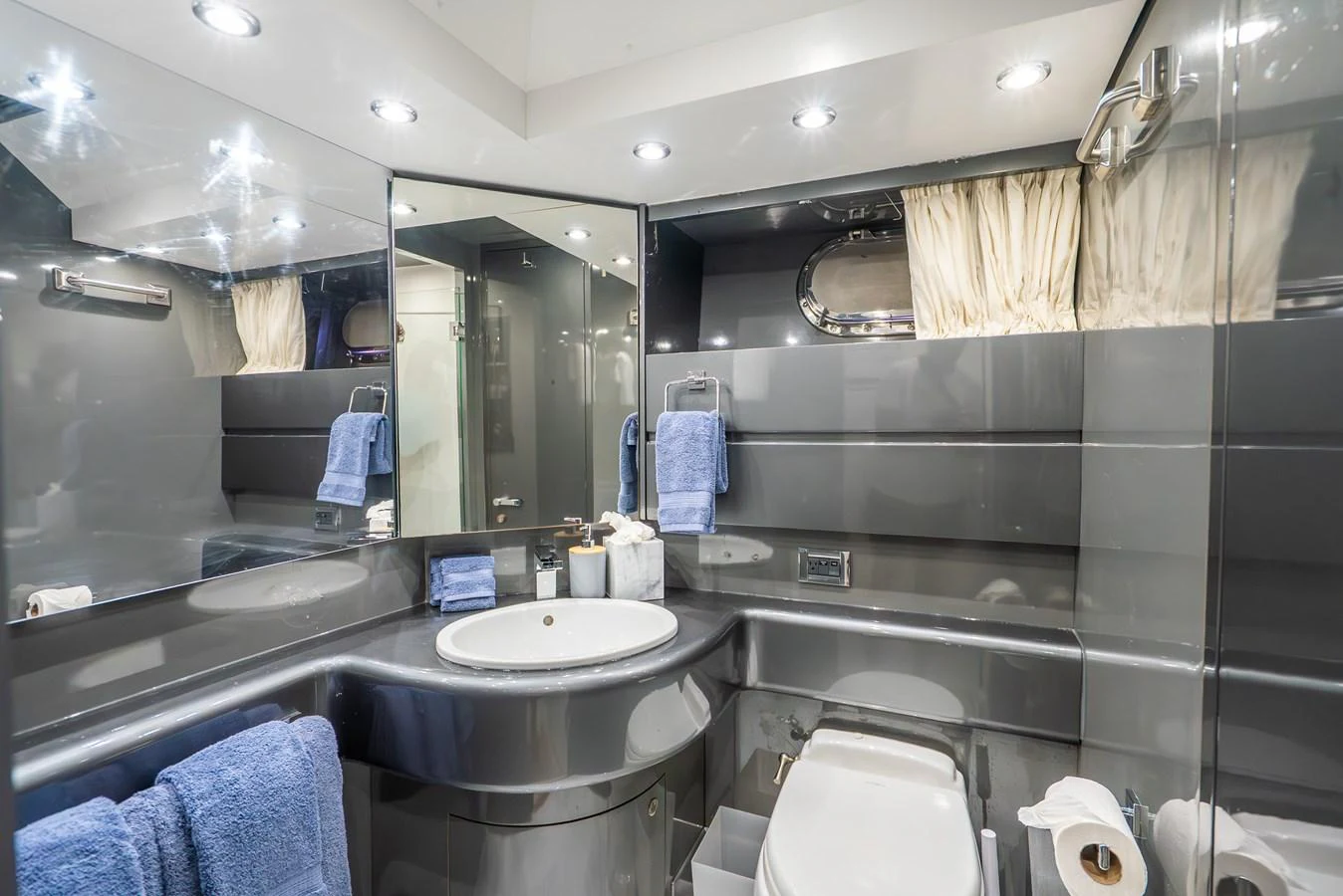 a bathroom with a large mirror aboard AZURE Yacht for Sale
