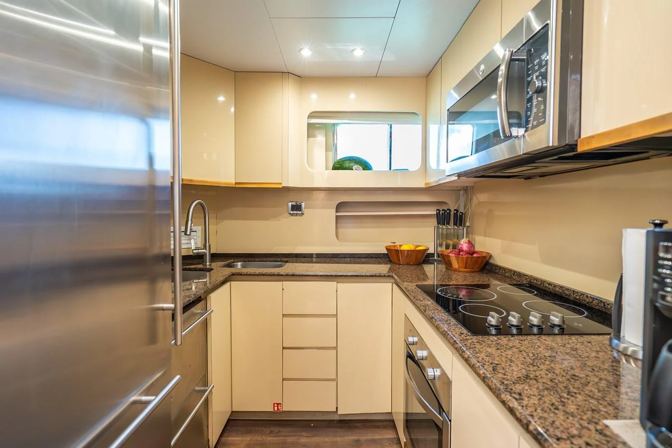 a kitchen with stainless steel appliances aboard AZURE Yacht for Sale
