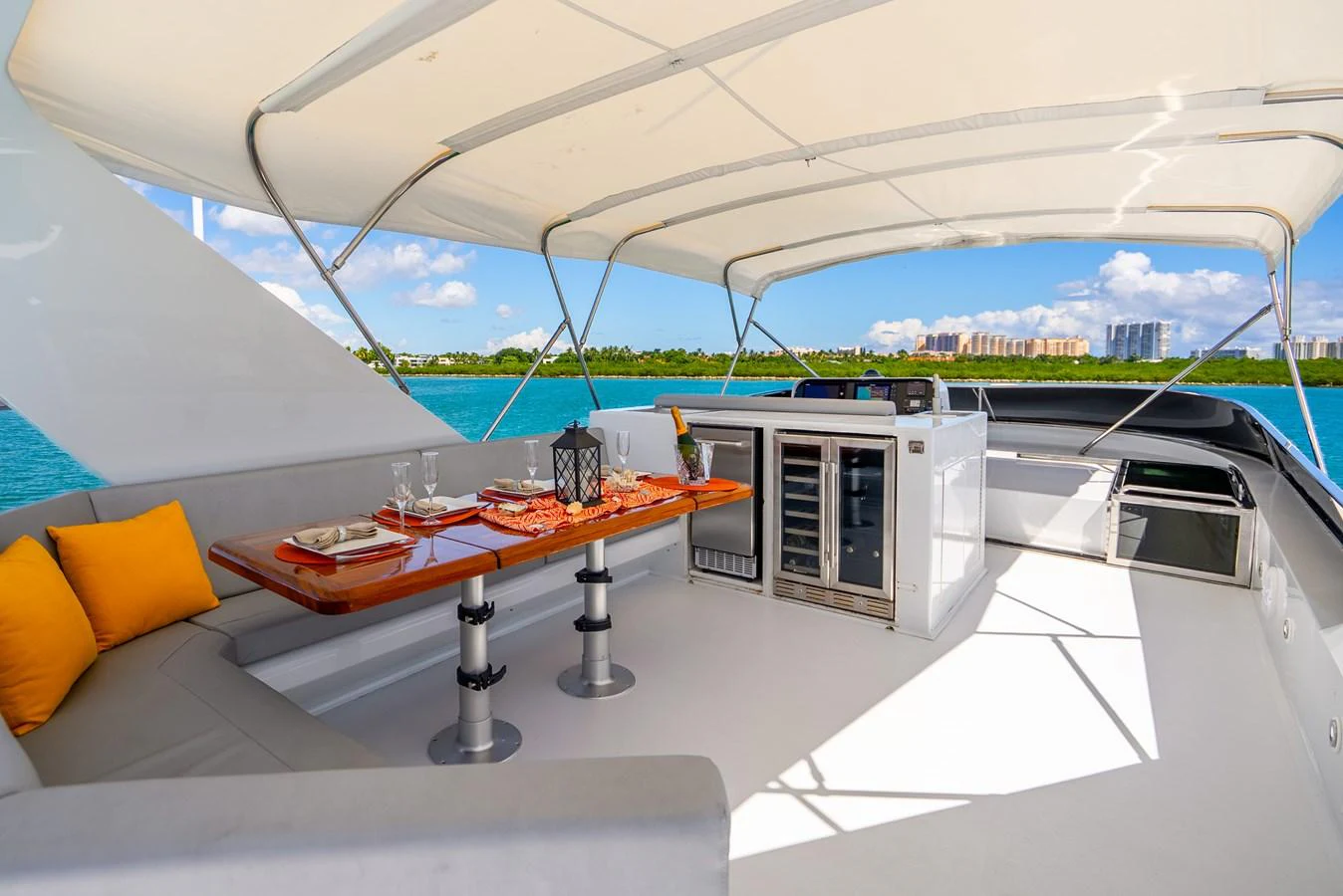 a room with a table and a bed aboard AZURE Yacht for Sale