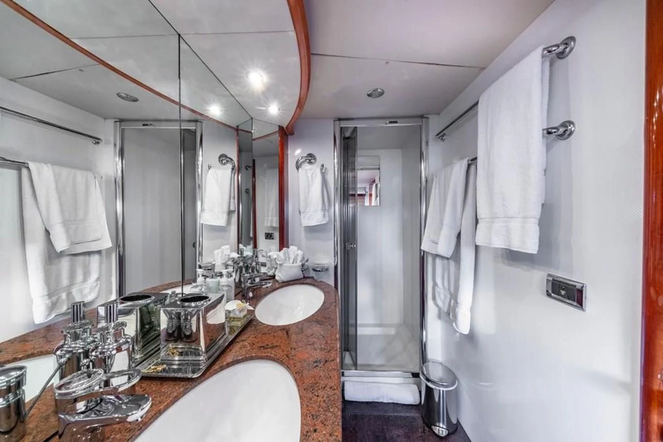 a bathroom with a countertop sink and a large mirror aboard ALAINA Yacht for Sale