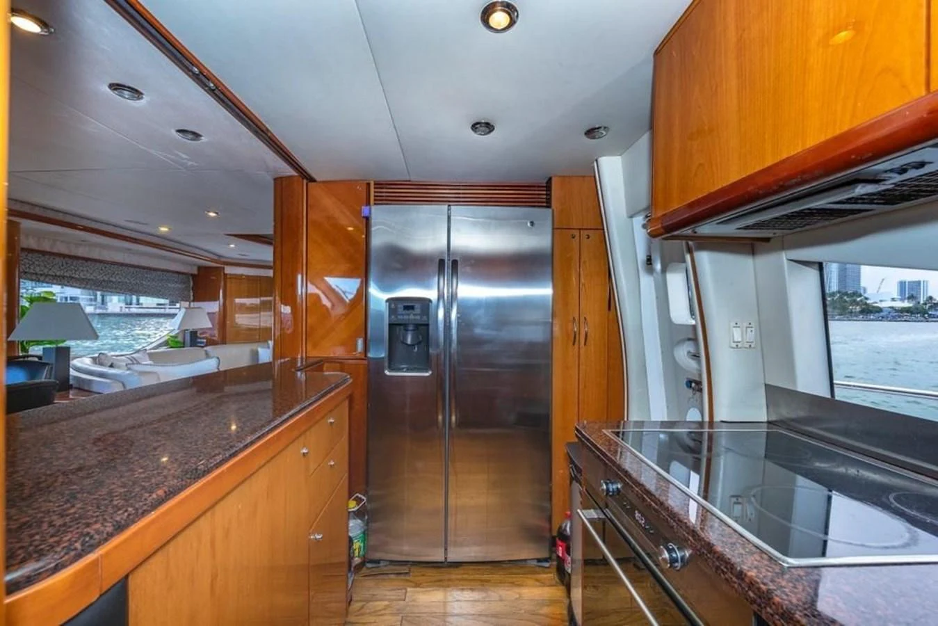 a kitchen with a glass door aboard ALAINA Yacht for Sale