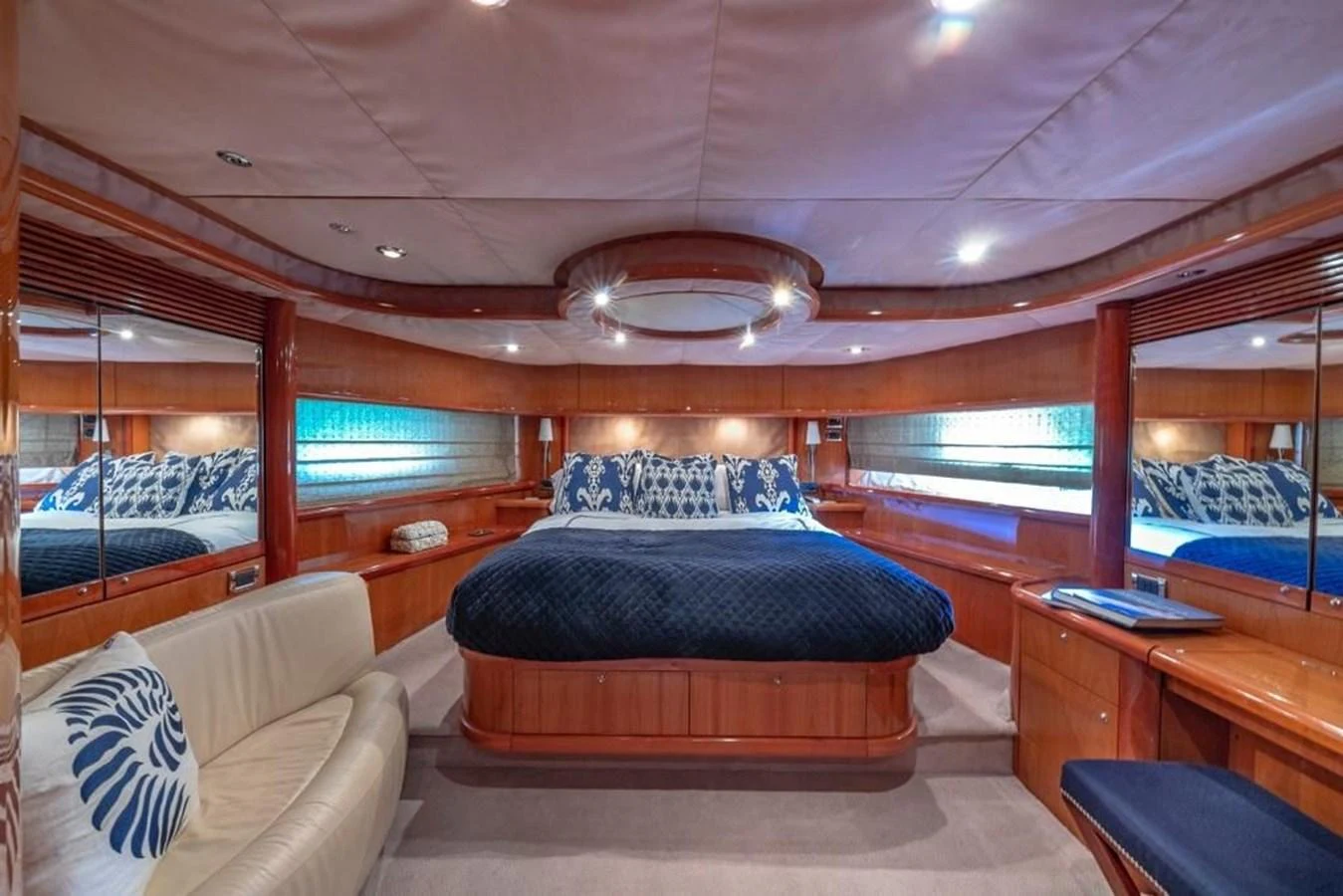 a room with a bed and a desk aboard ALAINA Yacht for Sale