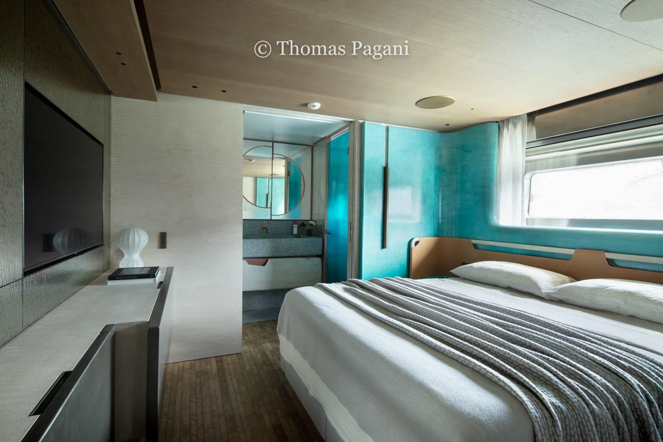 a room with a bed and a window aboard MOUCHKA Yacht for Sale