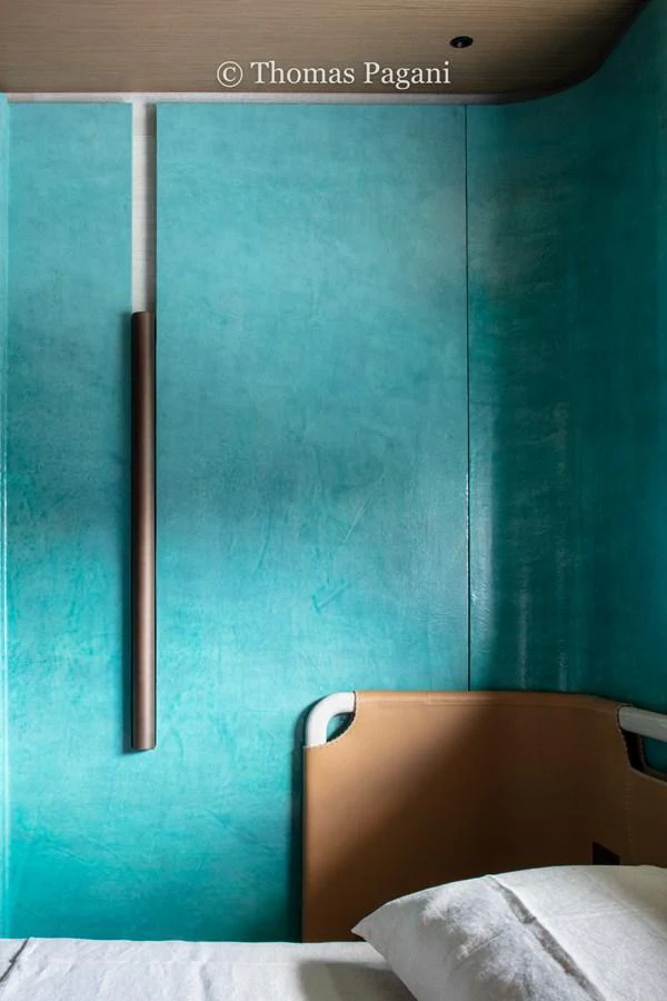 a blue wall with a metal bar aboard MOUCHKA Yacht for Sale