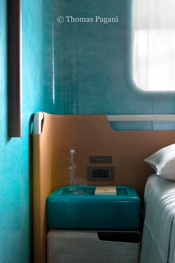 a blue box with a bottle on top of it aboard MOUCHKA Yacht for Sale