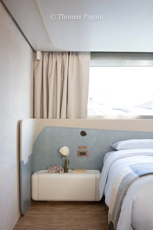 a room with a bed and a window aboard MOUCHKA Yacht for Sale