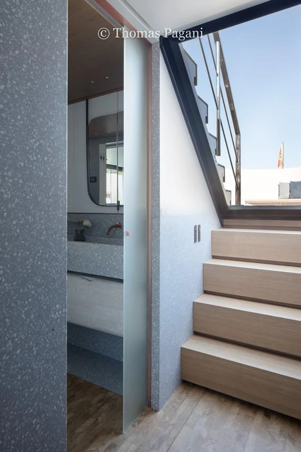 a wood staircase leading to a bathroom aboard MOUCHKA Yacht for Sale