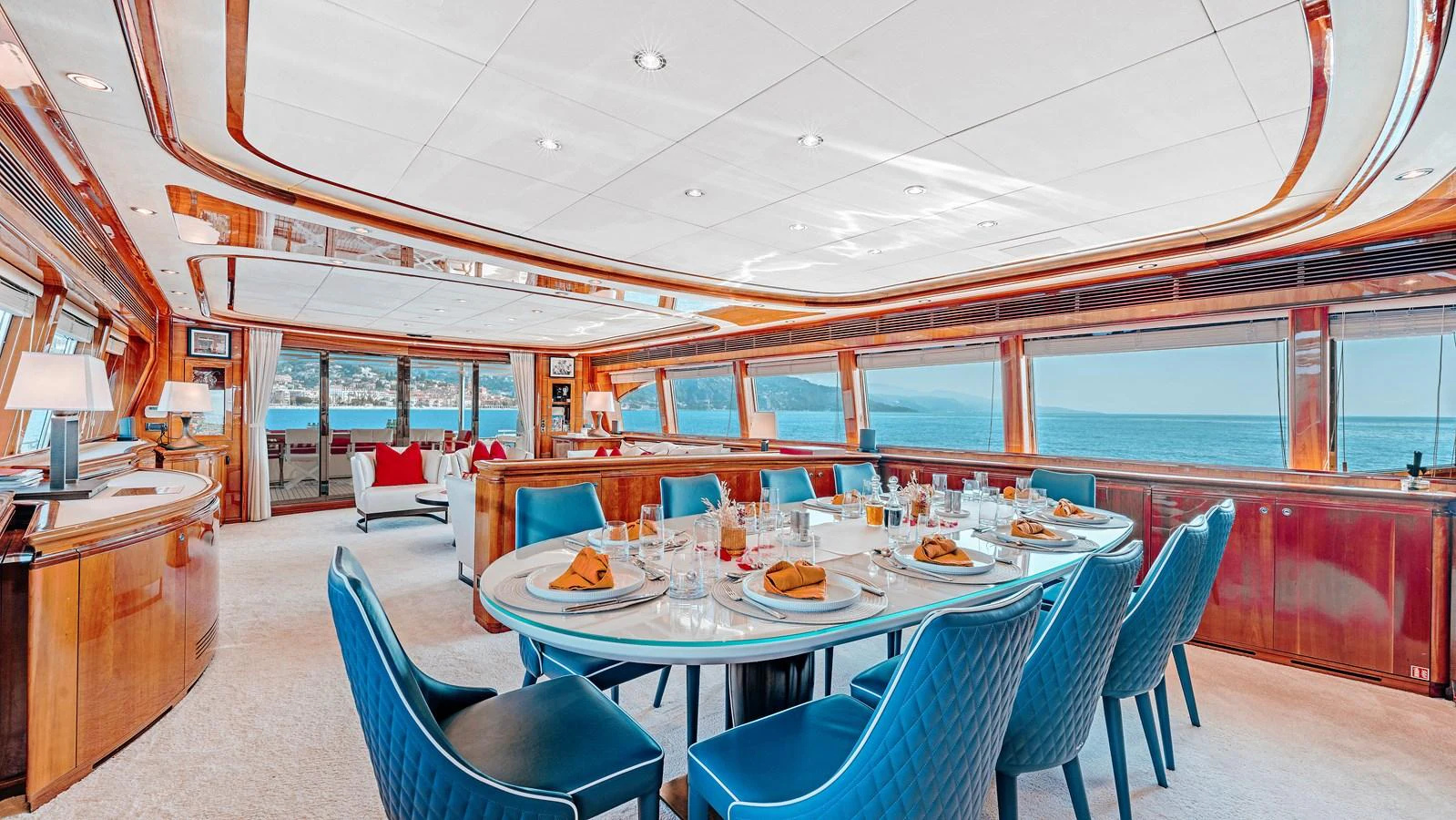 The yacht's dining area features a spacious and elegant setup with panoramic ocean views. aboard CHAMPAGNE AND CAVIAR Yacht for Sale
