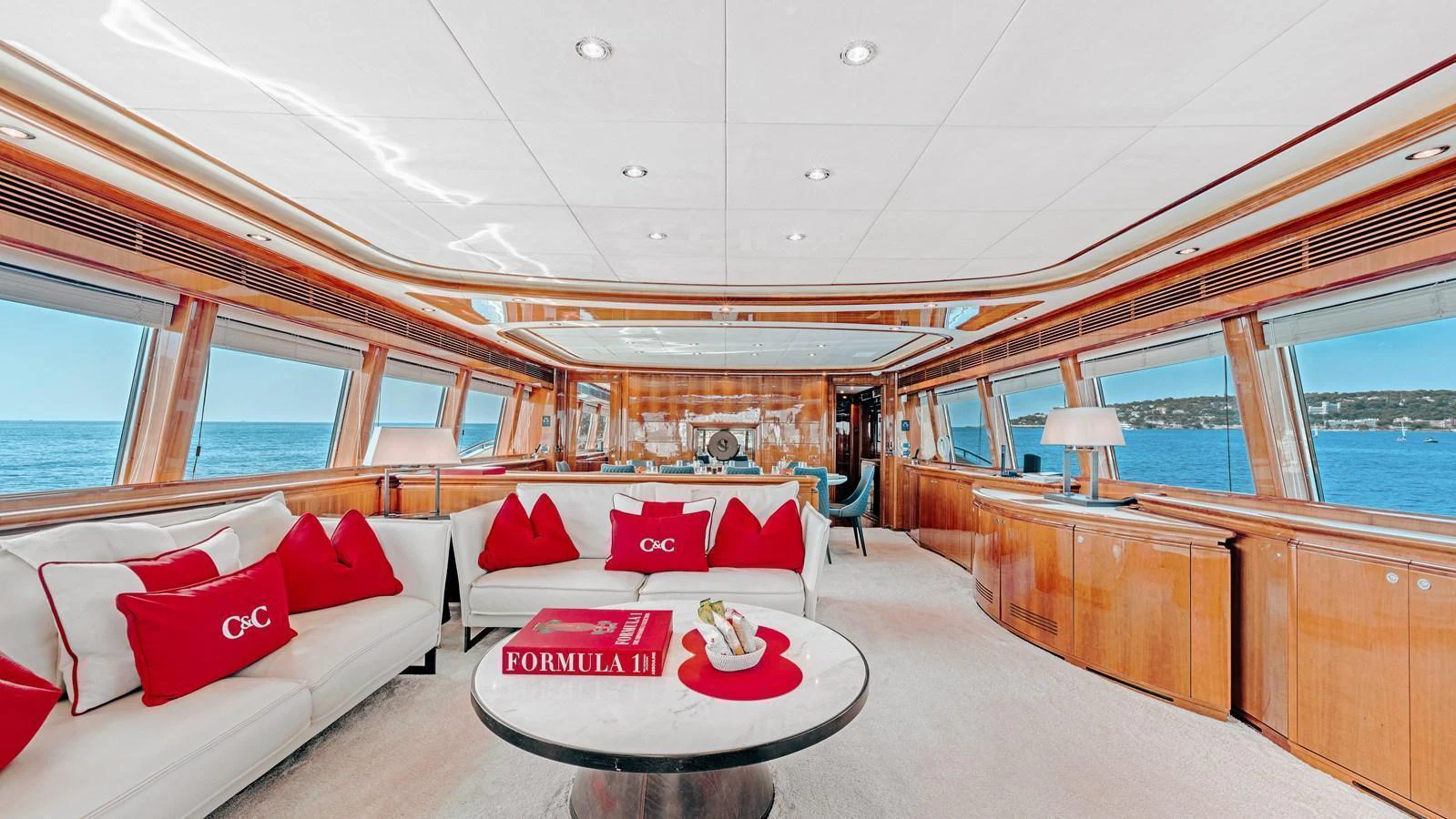 The salon offers a spacious and elegant seating area with panoramic views of the sea. aboard CHAMPAGNE AND CAVIAR Yacht for Sale