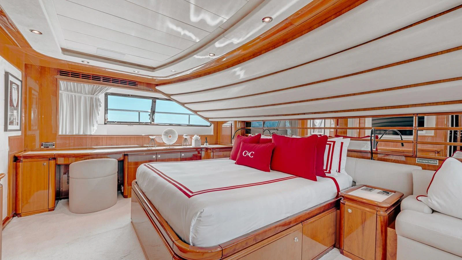 The master stateroom features luxurious bedding and elegant wood finishes, creating a serene and sophisticated retreat. aboard CHAMPAGNE AND CAVIAR Yacht for Sale