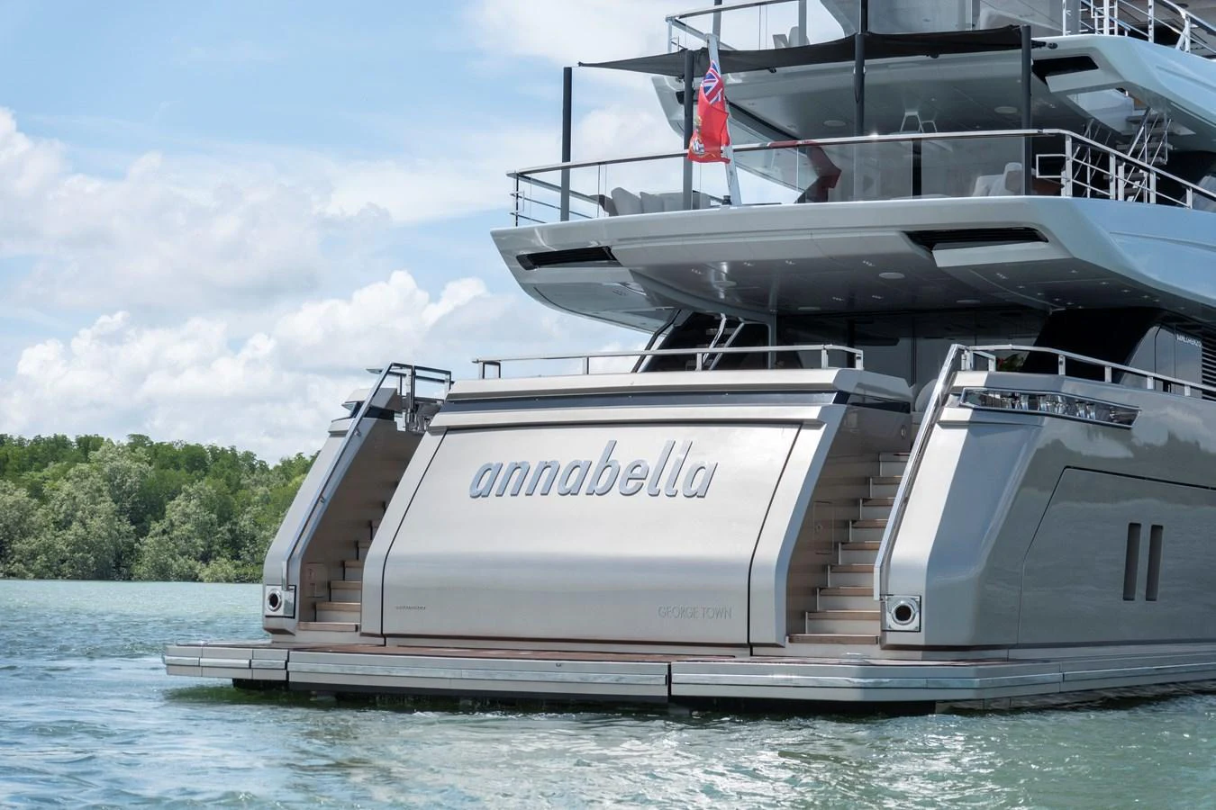The yacht's sleek aft deck features elegant stairs leading up from the swim platform, showcasing modern design and luxury. aboard ANNABELLA Yacht for Sale