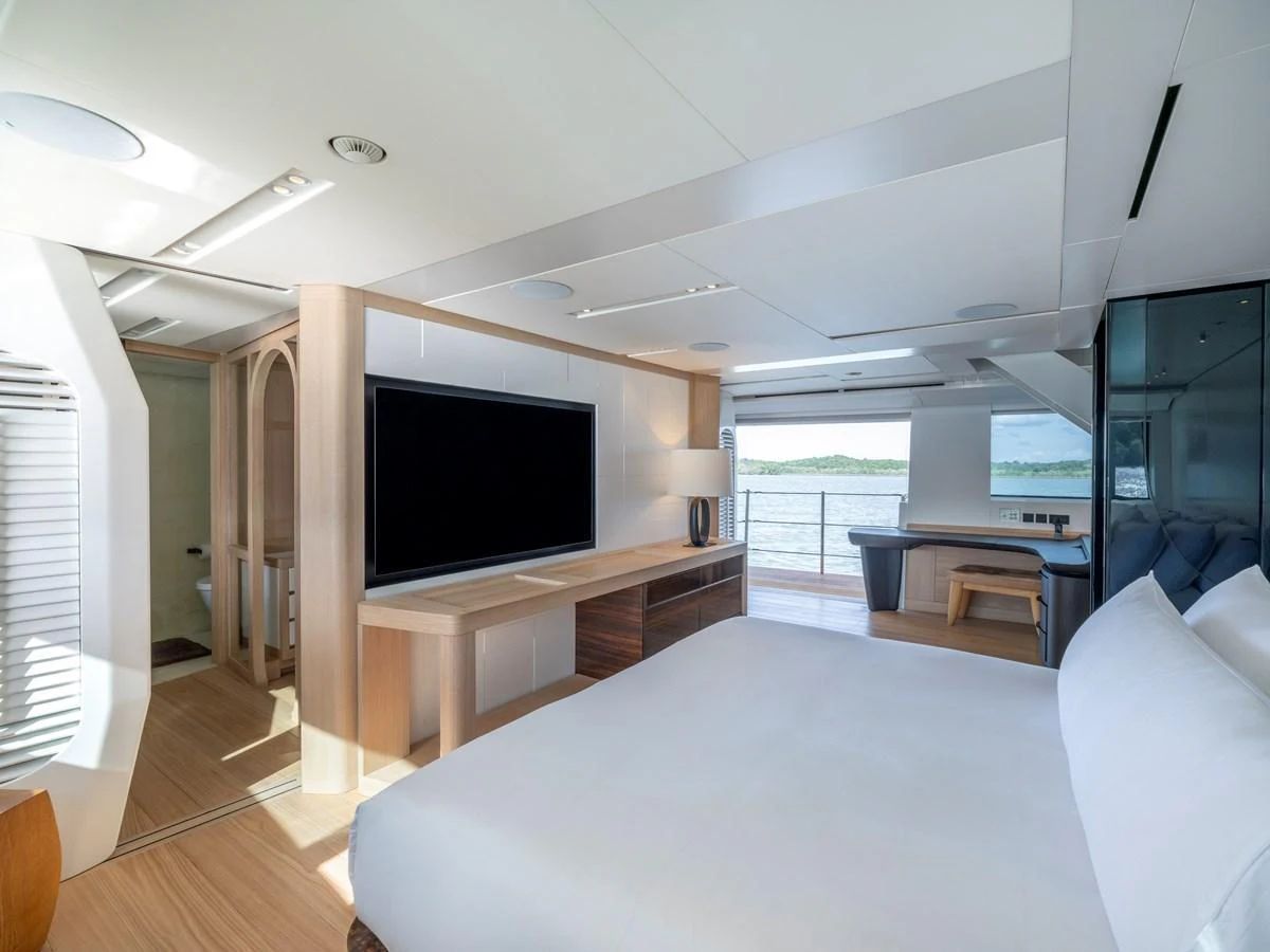 The master stateroom offers a spacious and modern retreat with a large bed and a stunning view of the water. aboard ANNABELLA Yacht for Sale