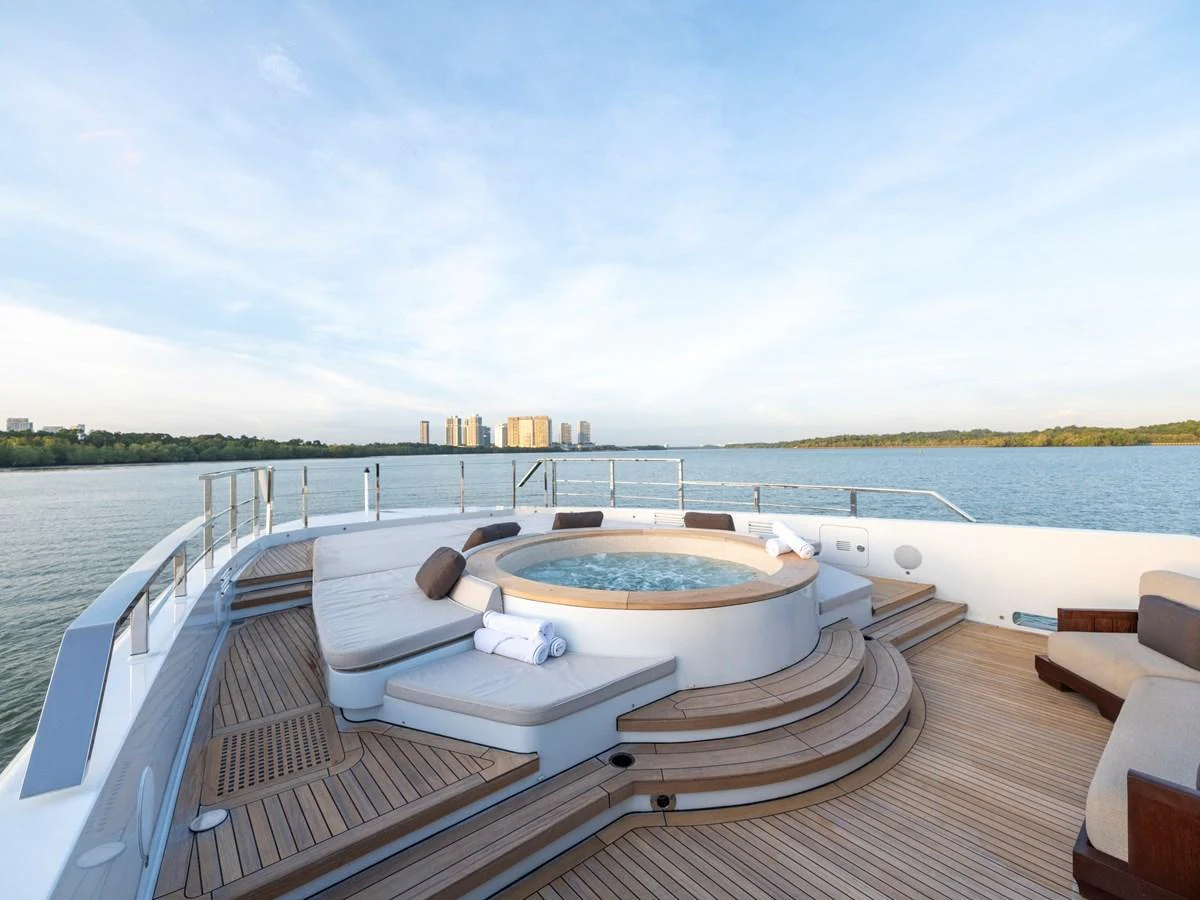 The sundeck features a luxurious jacuzzi surrounded by comfortable seating with a stunning view of the water. aboard ANNABELLA Yacht for Sale