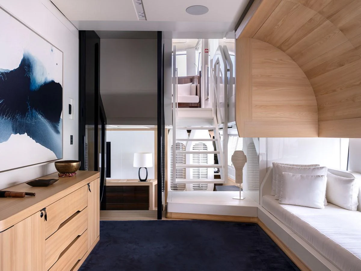 A modern and stylish interior space featuring a cozy seating area and elegant wooden accents. aboard ANNABELLA Yacht for Sale
