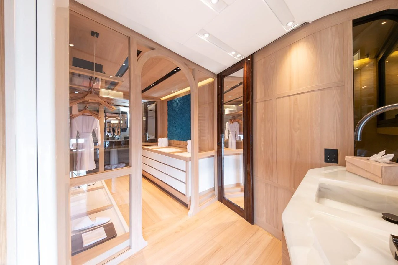 The yacht's bathroom features elegant wood paneling and modern fixtures, creating a serene and luxurious atmosphere. aboard ANNABELLA Yacht for Sale