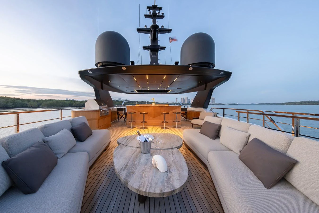 The yacht's aft deck features luxurious seating and a stylish bar area, perfect for relaxation and socializing. aboard ANNABELLA Yacht for Sale