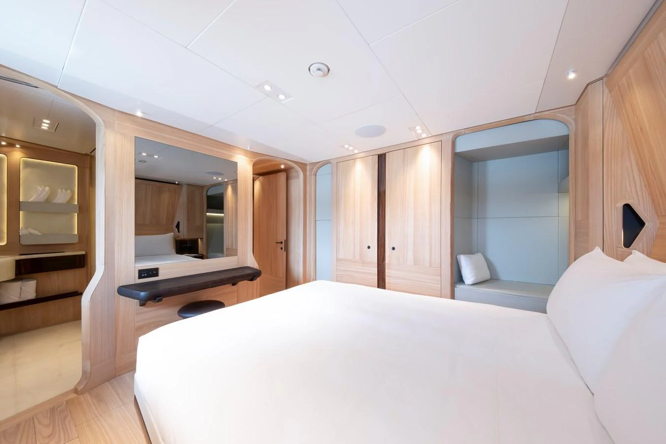 A serene and spacious stateroom featuring light wood finishes and modern amenities. aboard ANNABELLA Yacht for Sale