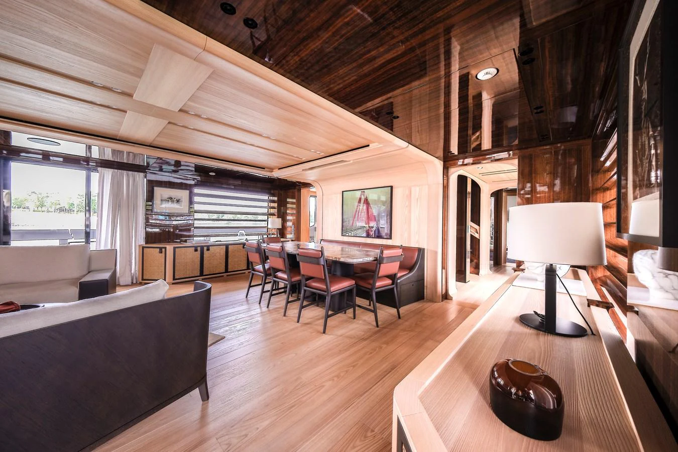 The yacht's salon features elegant wood finishes and ample natural light, creating a warm and inviting atmosphere. aboard ANNABELLA Yacht for Sale