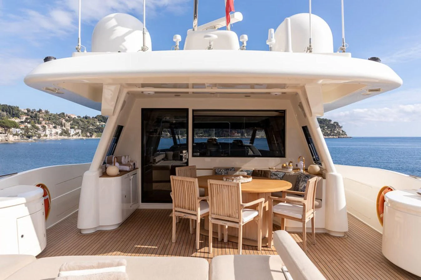 a boat with a table and chairs aboard LA PAUSA Yacht for Sale