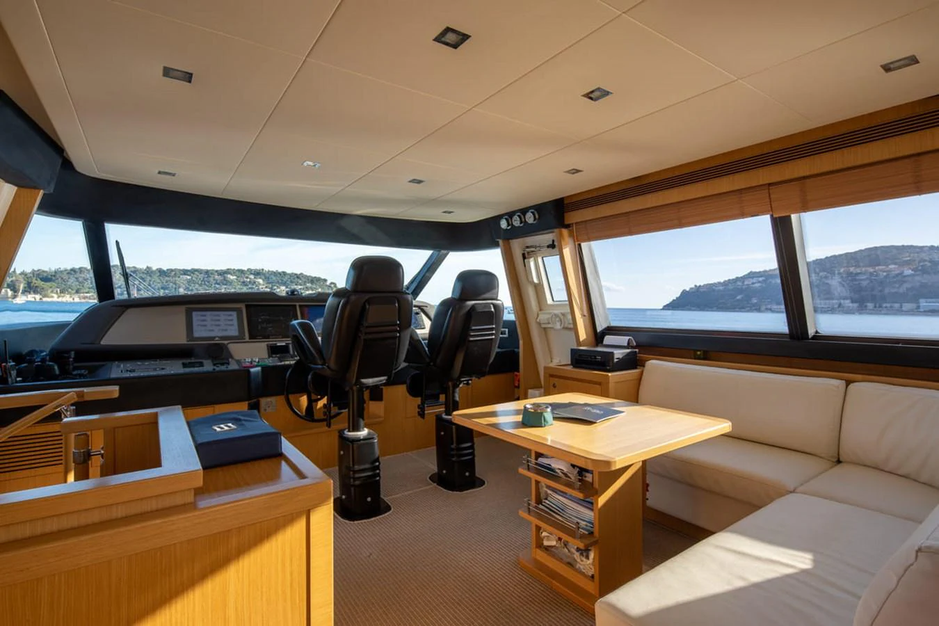 inside of a vehicle with a desk and a chair aboard LA PAUSA Yacht for Sale