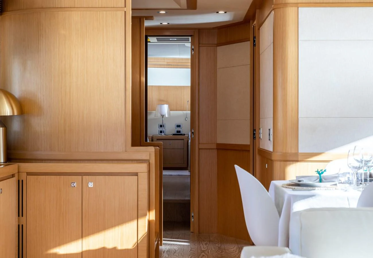 a kitchen with wooden cabinets aboard LA PAUSA Yacht for Sale