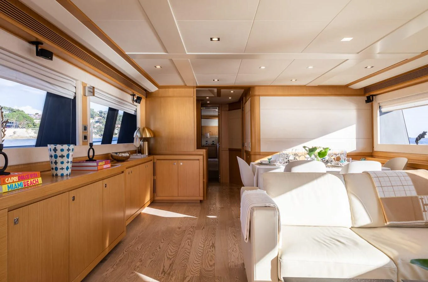 a living room with a couch and a table aboard LA PAUSA Yacht for Sale