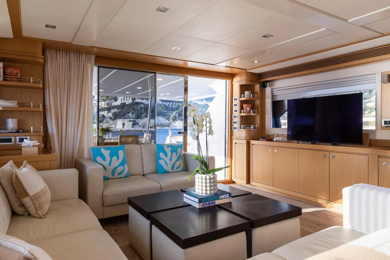 a living room with a large window aboard LA PAUSA Yacht for Sale
