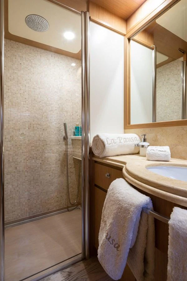 a bathroom with a shower unit and sink aboard LA PAUSA Yacht for Sale