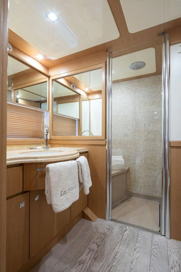 a bathroom with a shower unit and sink aboard LA PAUSA Yacht for Sale