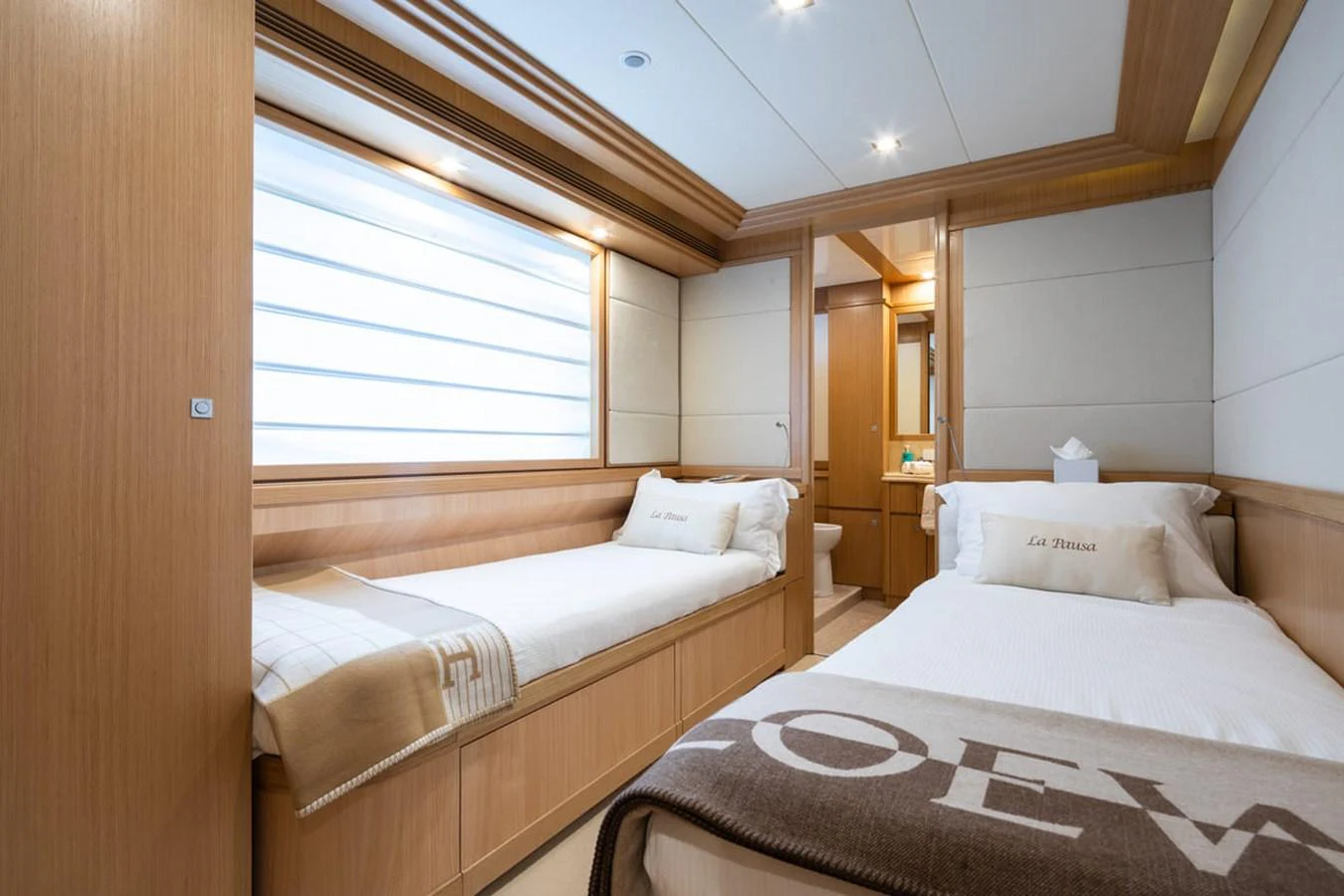 a couple of beds in a room aboard LA PAUSA Yacht for Sale