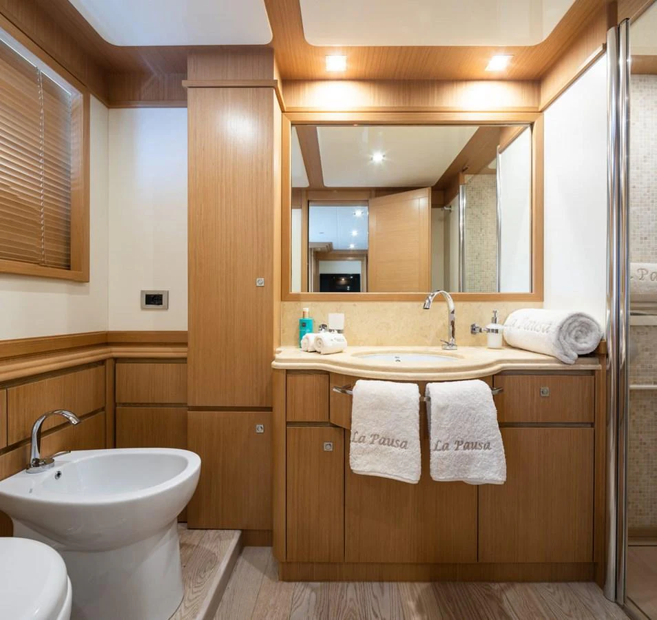 a bathroom with a sink and a mirror aboard LA PAUSA Yacht for Sale