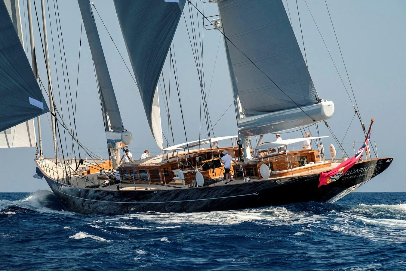 A stunning sailing yacht glides gracefully through the open sea, showcasing its sleek design and elegant sails. aboard APSARA Yacht for Sale
