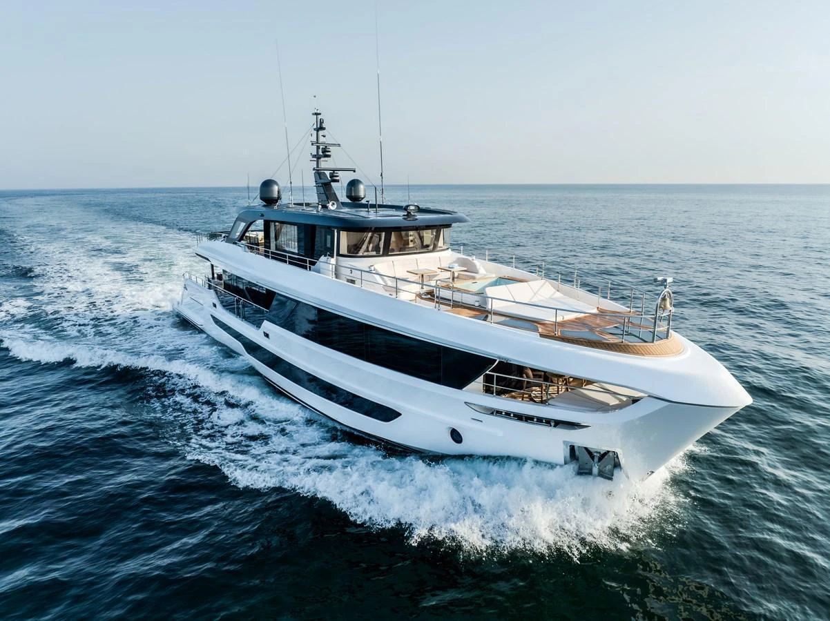 A sleek and modern yacht cruises through calm waters, showcasing its elegant design and spacious deck areas. aboard 100 TERRACE ON-ORDER Yacht for Sale