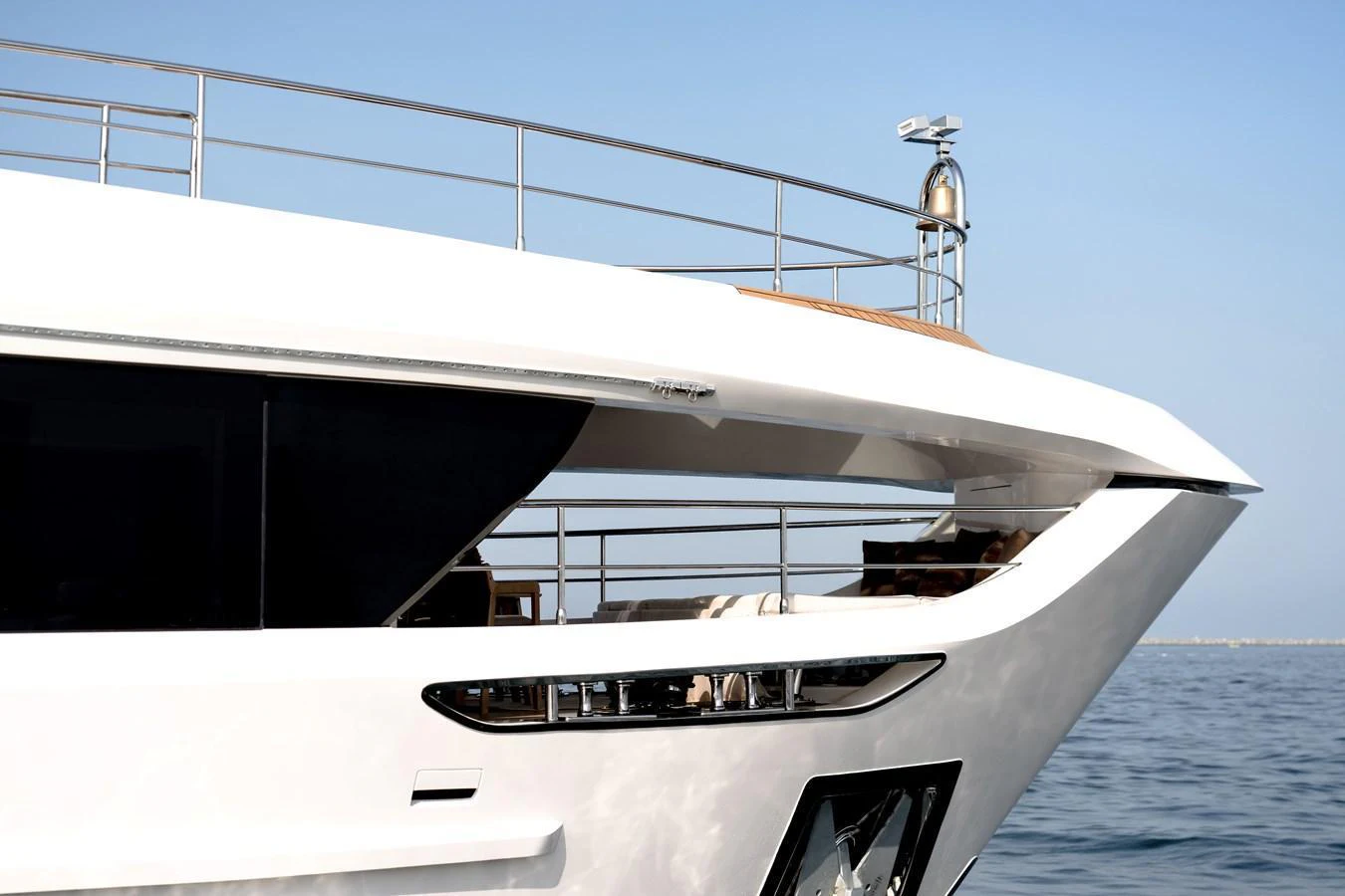 A sleek and modern yacht with a pristine white exterior gliding on calm waters. aboard 100 TERRACE ON-ORDER Yacht for Sale
