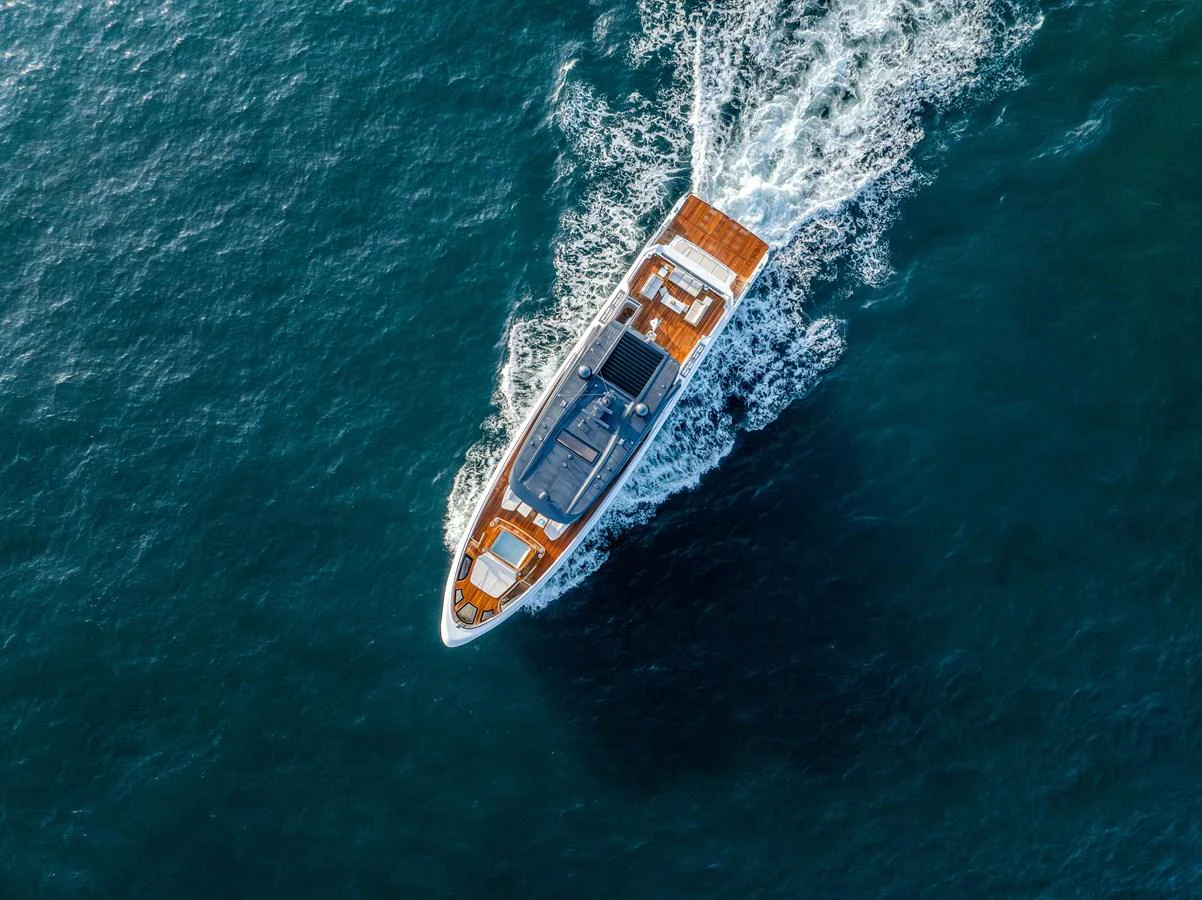 An elegant yacht cruises through the open sea, showcasing its sleek design and luxurious deck space. aboard 100 TERRACE ON-ORDER Yacht for Sale