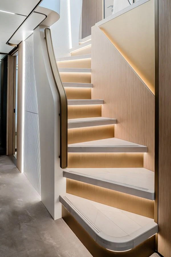 A beautifully designed staircase with modern lighting and sleek finishes. aboard 100 TERRACE ON-ORDER Yacht for Sale