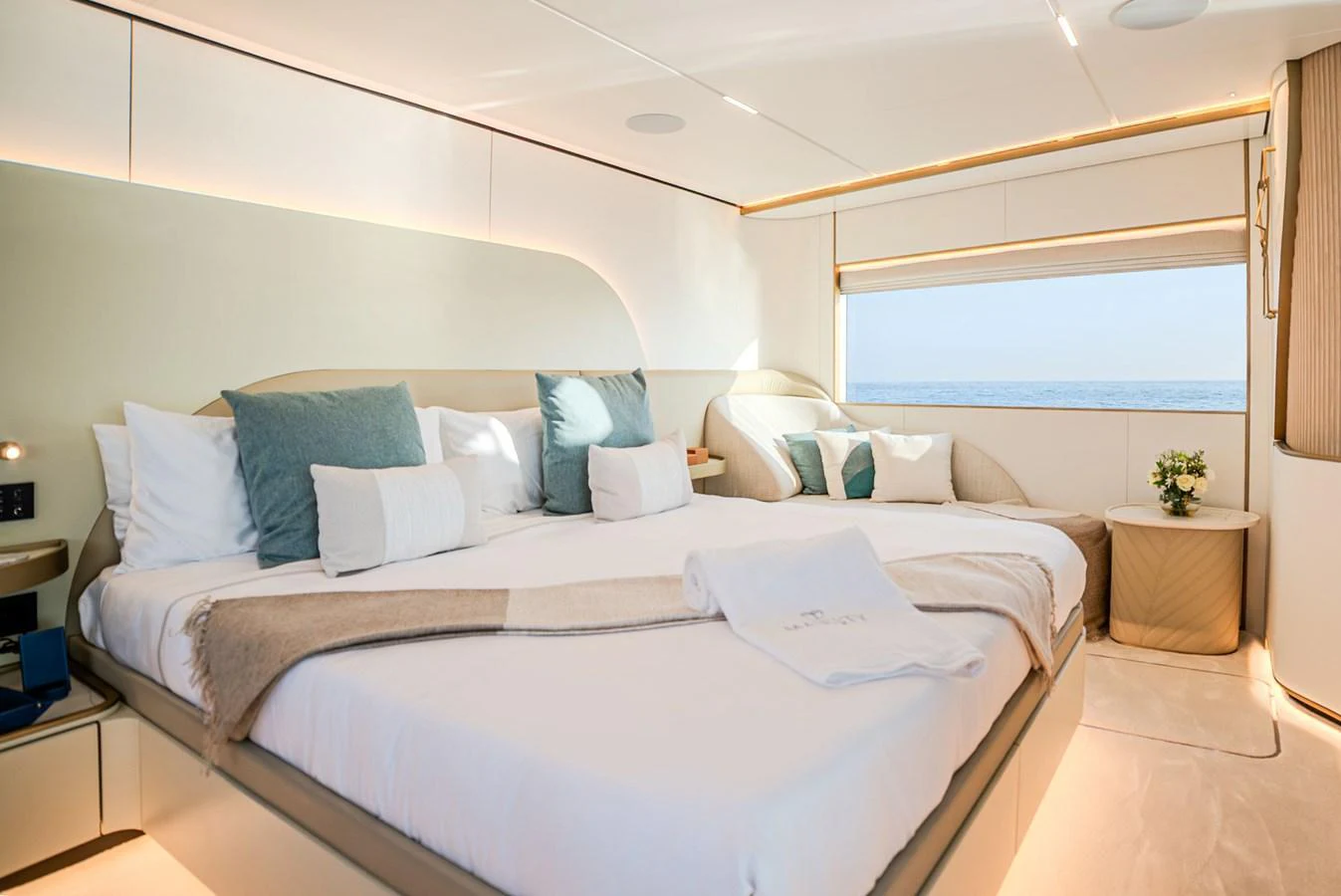 The stateroom features a spacious bed with elegant bedding and a large window offering a stunning sea view. aboard 100 TERRACE ON-ORDER Yacht for Sale