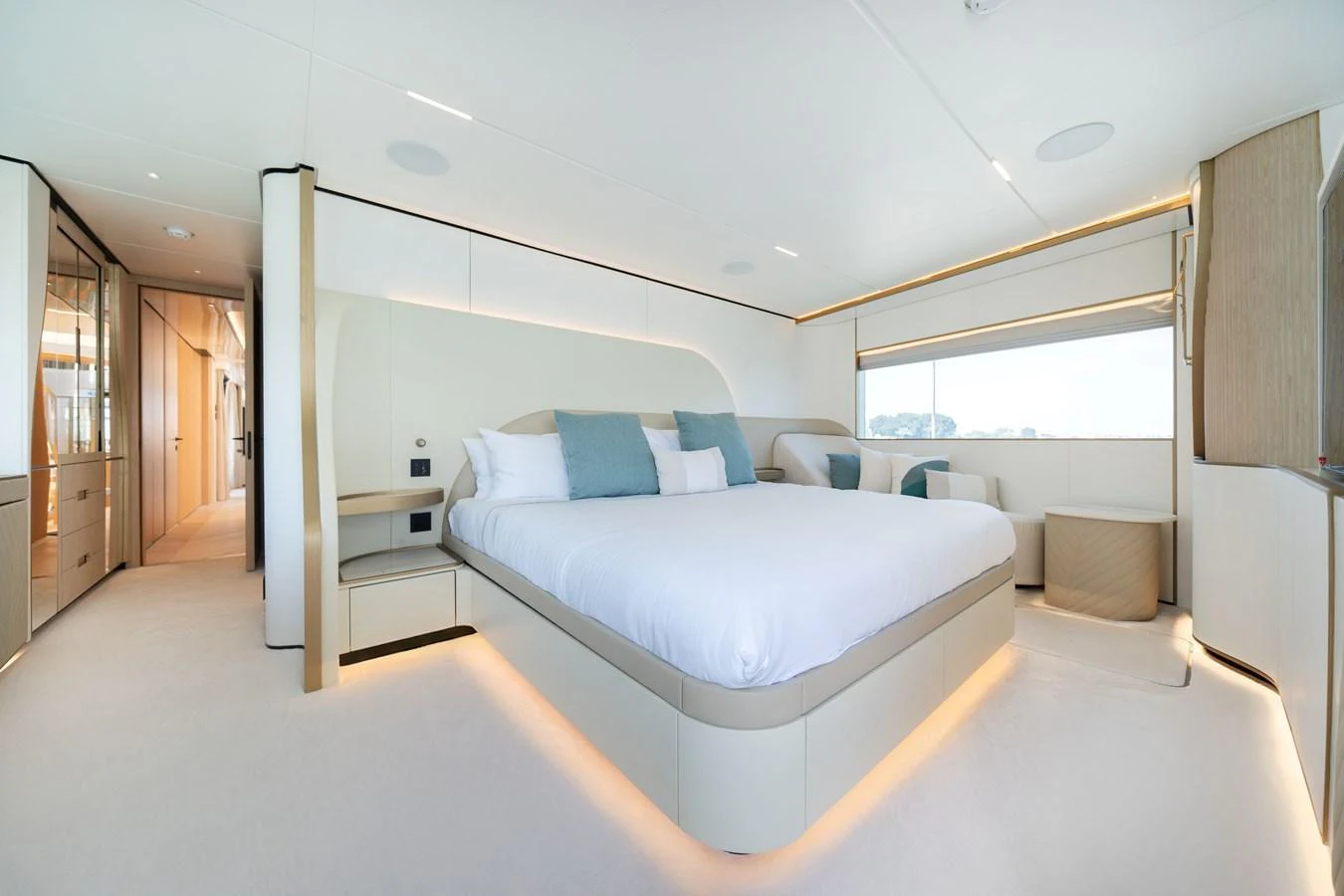 The master stateroom features a luxurious bed with elegant lighting and ample natural light. aboard 100 TERRACE ON-ORDER Yacht for Sale