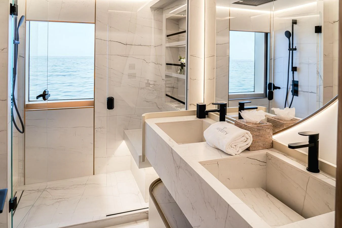 The yacht's bathroom features elegant marble surfaces and modern fixtures with a view of the sea. aboard 100 TERRACE ON-ORDER Yacht for Sale