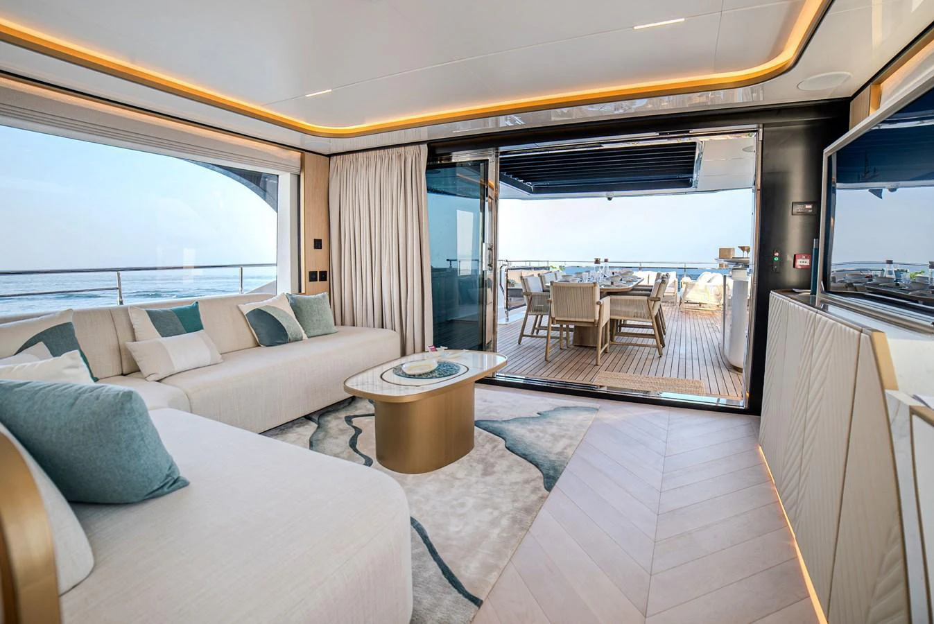The salon offers a luxurious and spacious area with a seamless transition to the outdoor deck, perfect for relaxation and entertainment. aboard 100 TERRACE ON-ORDER Yacht for Sale
