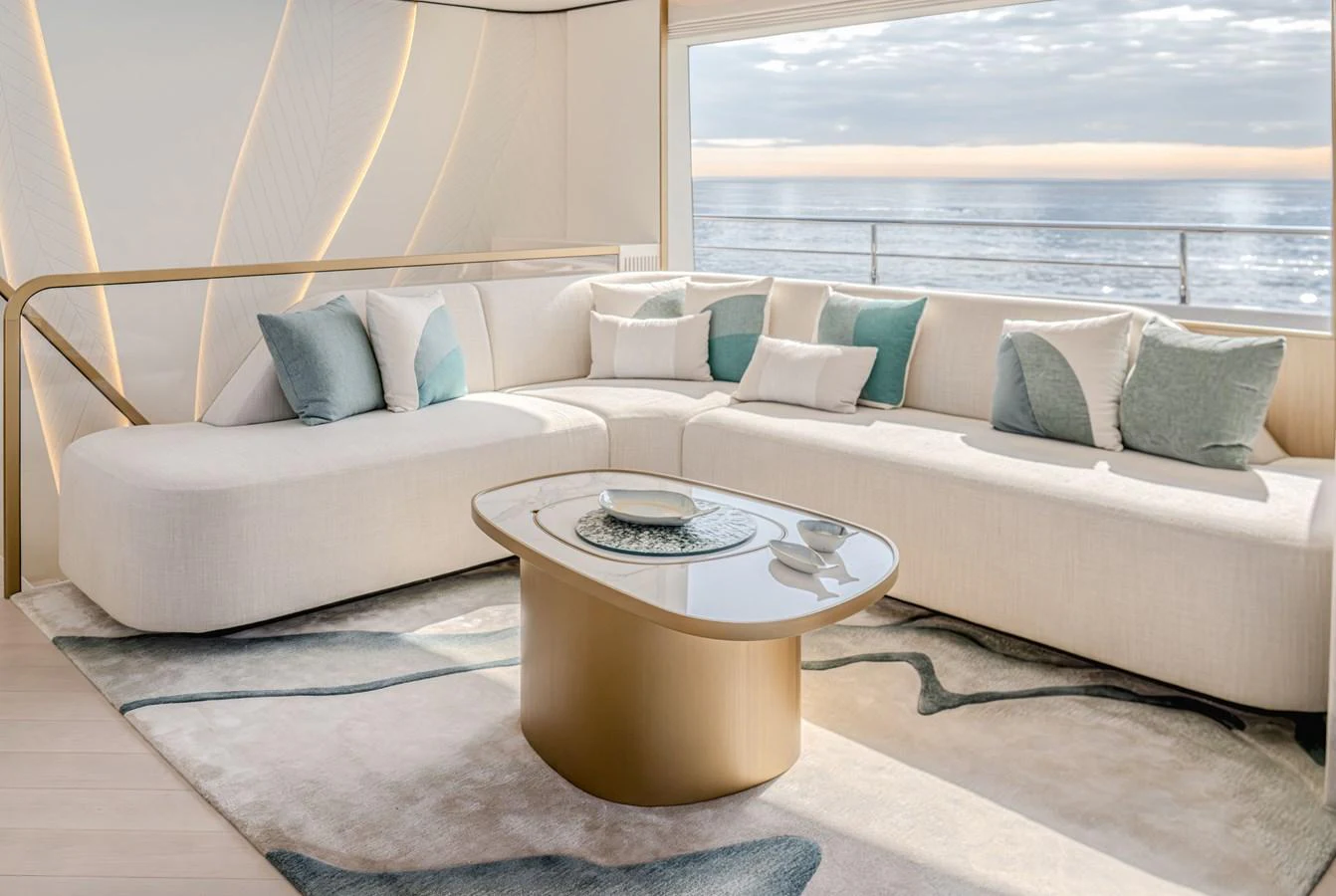 The salon features a modern and elegant seating area with a stunning ocean view. aboard 100 TERRACE ON-ORDER Yacht for Sale