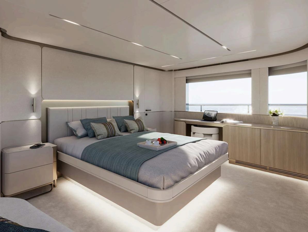 The master stateroom features a luxurious bed with elegant bedding and ample natural light. aboard NOMAD 101 ON-ORDER Yacht for Sale