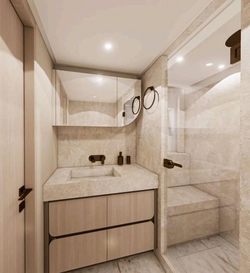 The yacht's bathroom features a sleek, modern design with elegant fixtures and ample storage. aboard NOMAD 101 ON-ORDER Yacht for Sale