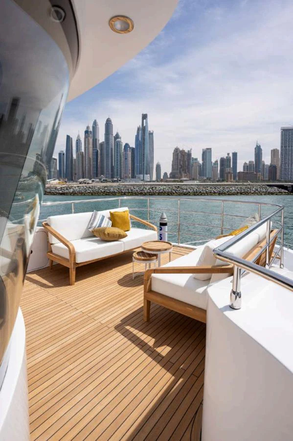 The aft deck offers a relaxing seating area with stunning views of the city skyline. aboard NOMAD 101 ON-ORDER Yacht for Sale